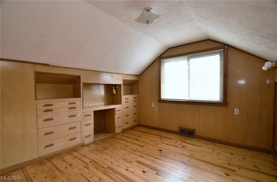 3681 Brinkmore Road Cleveland Heights, OH 44121 - Photo 23 of 27 Additional living space 8with built in features, light wood-type flooring, and vaulted ceiling