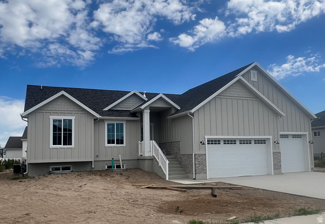 4740 West 25 North West Point, UT 84015 - Photo 1 of 15 Contemporary single-story residence featuring a dark shingle roof and light gray vertical siding