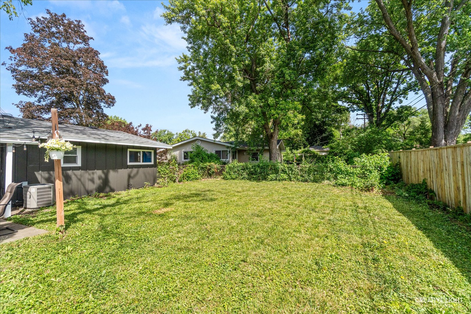 4 Woodcliff Road Montgomery, IL 60538 - Photo 17 of 18 a view of a house with backyard and a tree