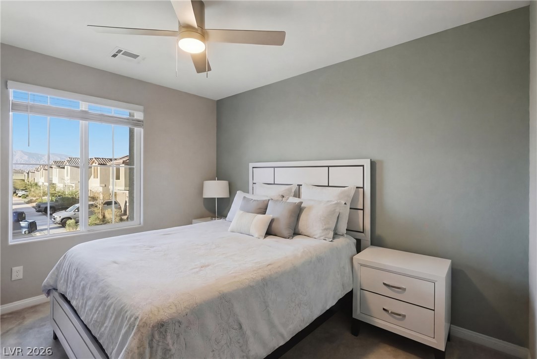 1921 Miller Ridge Avenue North Las Vegas, NV 89031 - Photo 15 of 26 This peaceful bedroom offers comfort and a tranquil escape.