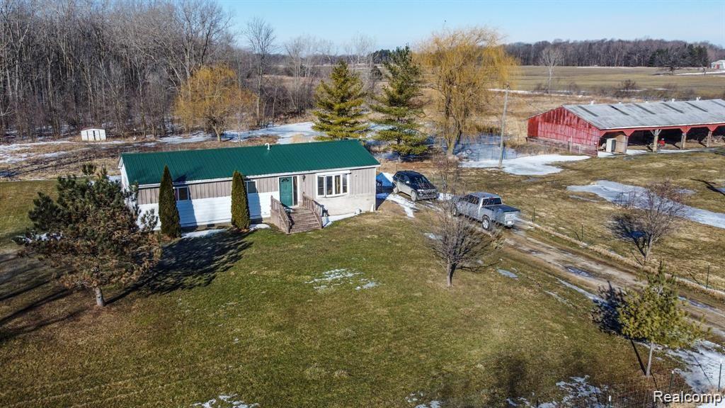 8620 Melvin Road Melvin, MI 48454 - Photo 4 of 24 Main house, driveway, pole barn