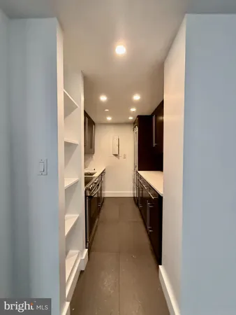 a view of hallway with stainless steel appliances