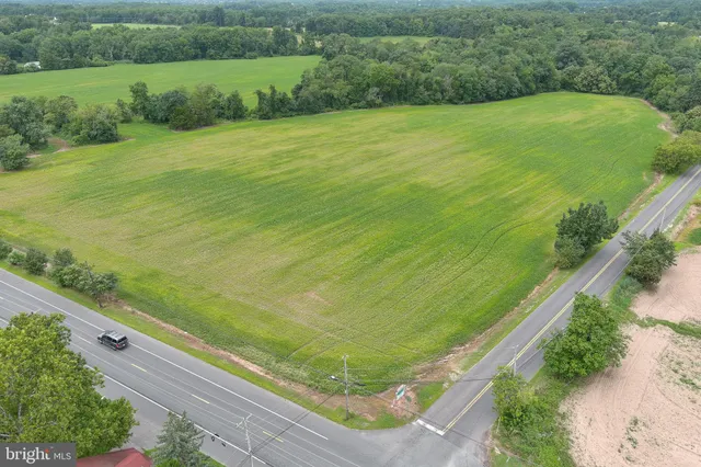 a view of a field with an ocean view