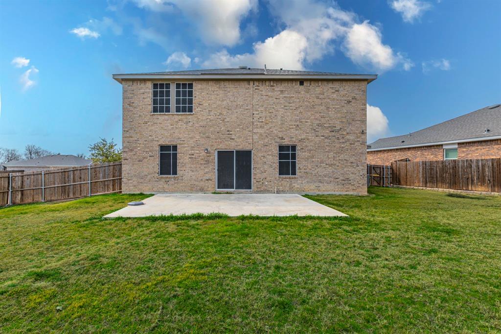 201 Sabine River Road Glenn Heights, TX 75154 - Photo 3 of 26 Back of house with brick siding, a patio area, and a fenced backyard