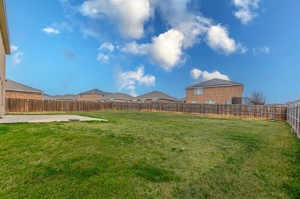 201 Sabine River Road Glenn Heights, TX 75154 - Photo 5 of 26 Fenced backyard featuring a patio area