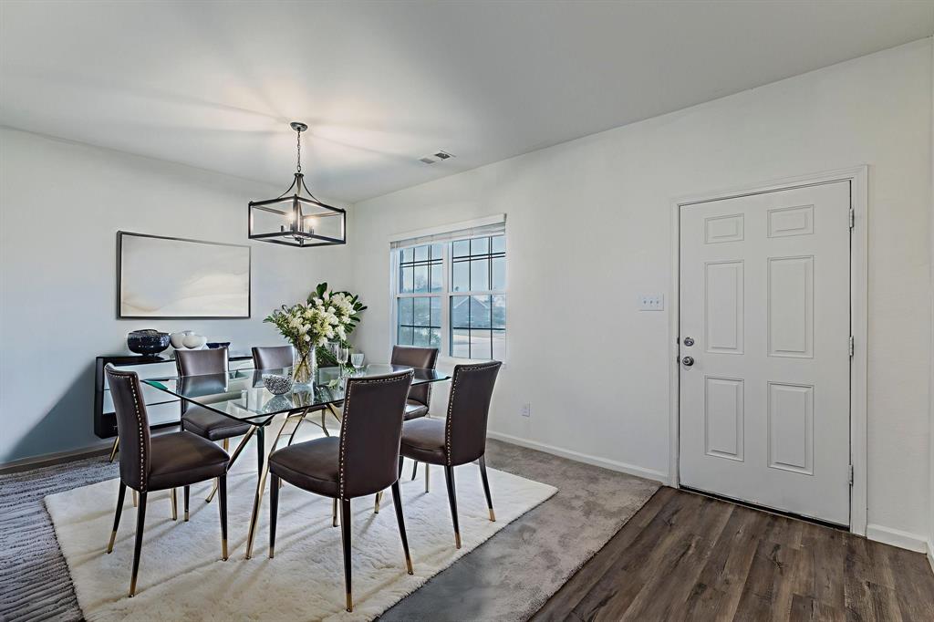 201 Sabine River Road Glenn Heights, TX 75154 - Photo 6 of 26 Dining room featuring a chandelier and dark wood like finished floors