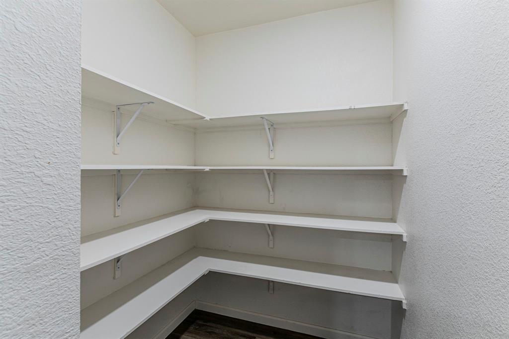 201 Sabine River Road Glenn Heights, TX 75154 - Photo 10 of 24 a storage room with an empty racks
