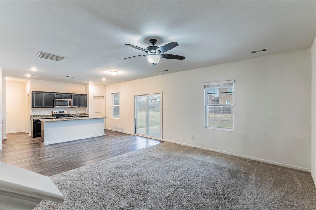201 Sabine River Road Glenn Heights, TX 75154 - Photo 9 of 26 Living room with ceiling fan and carpet