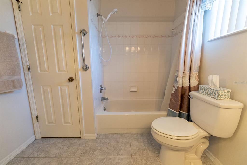 10470 Southwest 61st Terrace Road Ocala, FL 34476 - Photo 43 of 63 a bathroom with a toilet and a shower