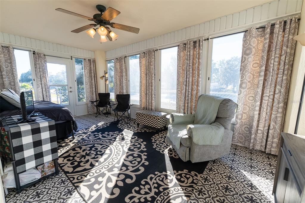 10470 Southwest 61st Terrace Road Ocala, FL 34476 - Photo 48 of 63 a living room with furniture and a large window