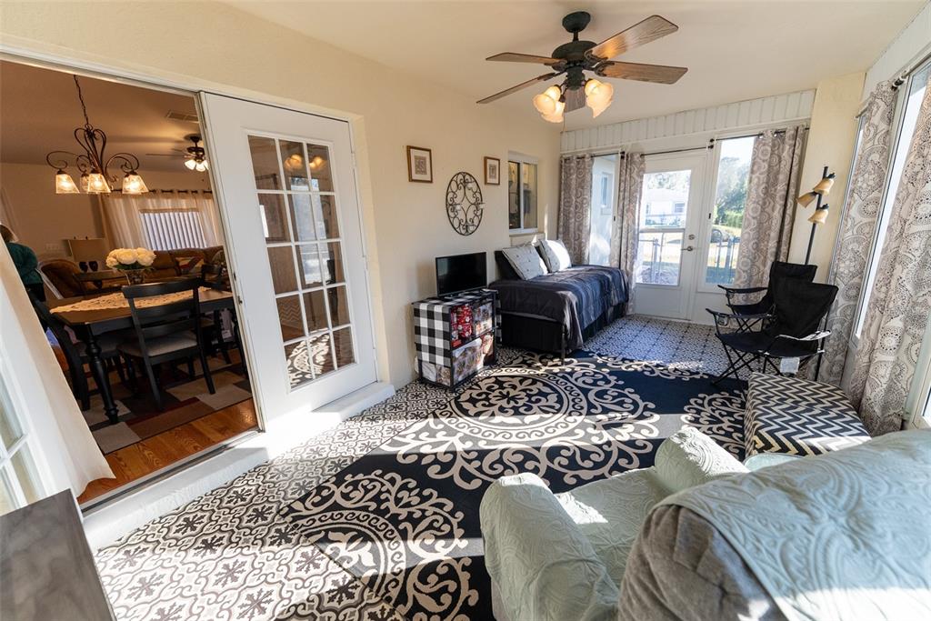 10470 Southwest 61st Terrace Road Ocala, FL 34476 - Photo 49 of 63 a living room with furniture rug and window