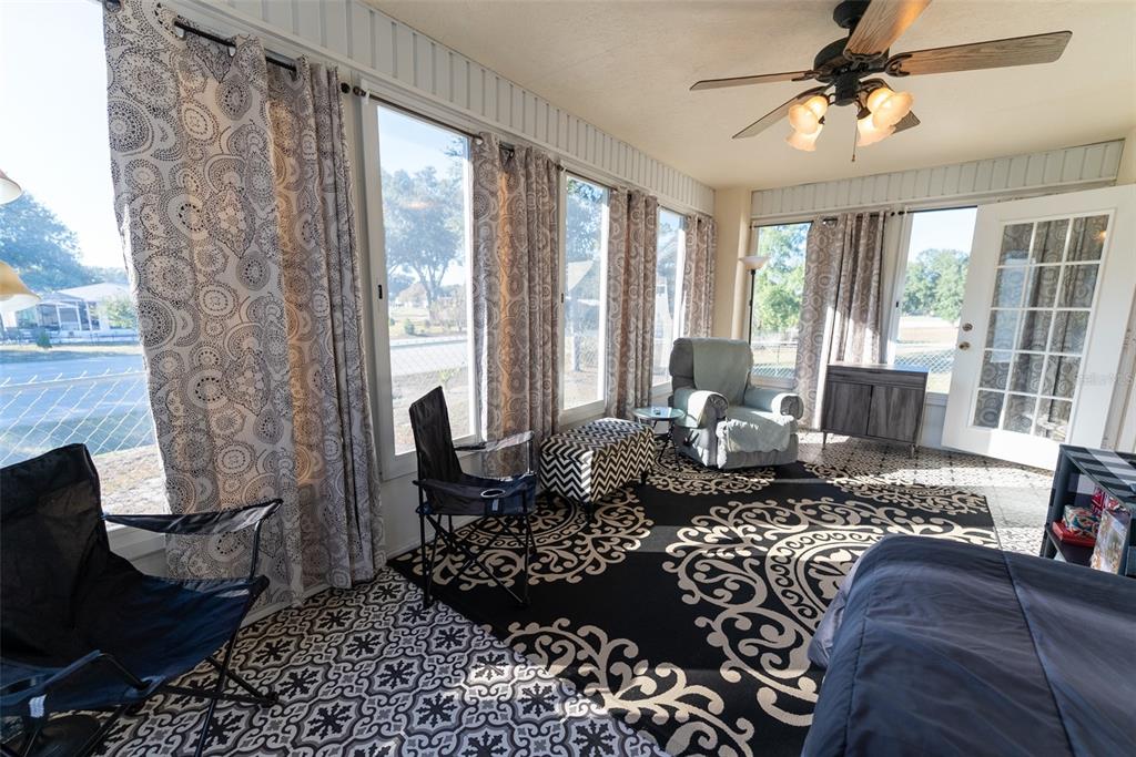 10470 Southwest 61st Terrace Road Ocala, FL 34476 - Photo 52 of 63 a living room with furniture or couch and a fireplace