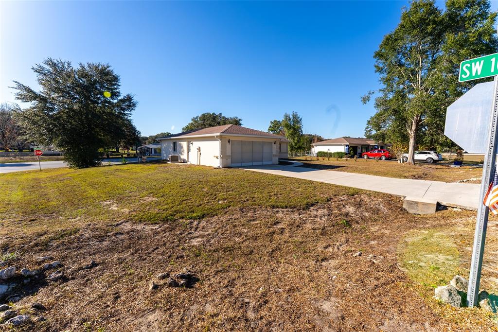 10470 Southwest 61st Terrace Road Ocala, FL 34476 - Photo 55 of 63 a view of a house with a yard and garage