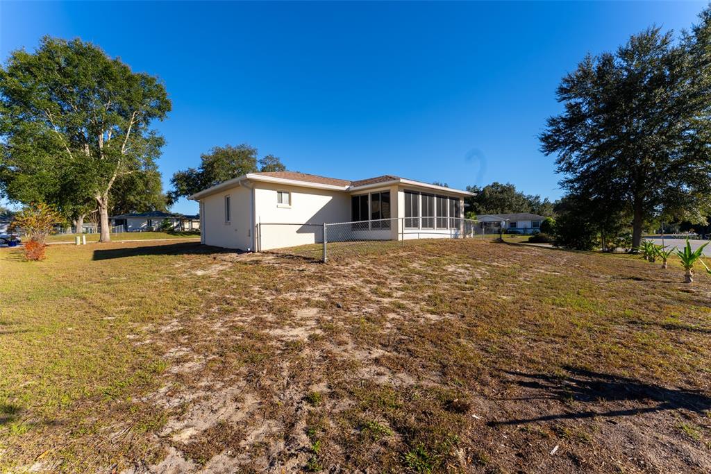 10470 Southwest 61st Terrace Road Ocala, FL 34476 - Photo 59 of 63 a view of a house with a yard