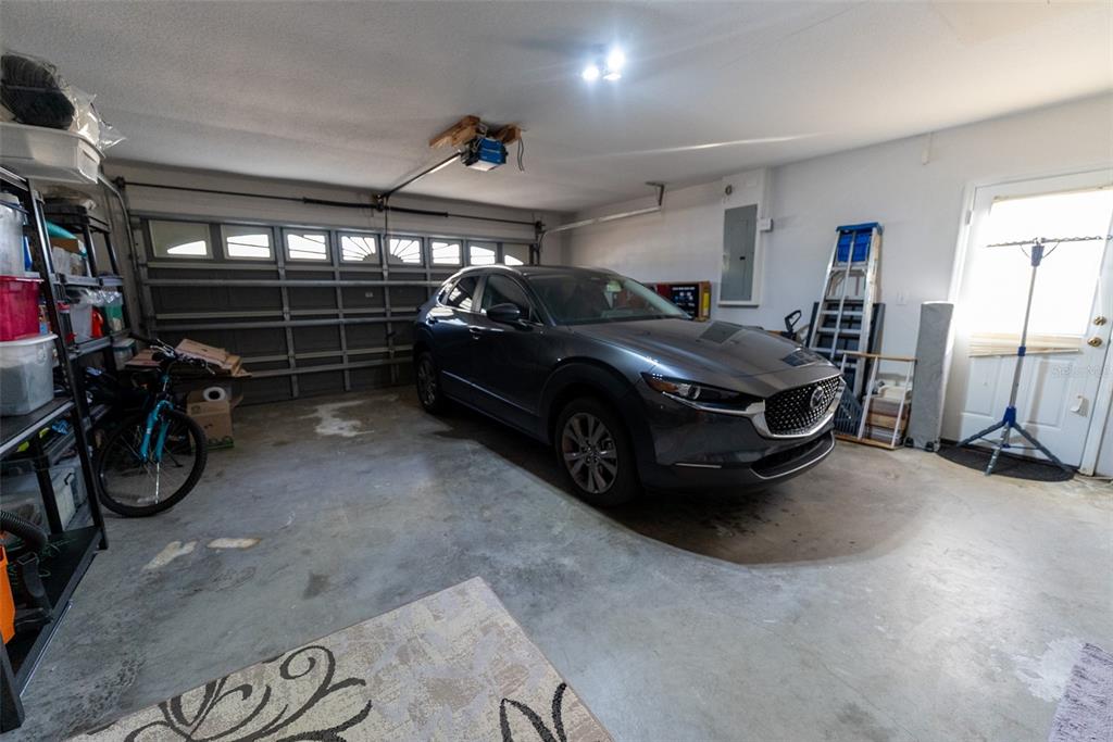 10470 Southwest 61st Terrace Road Ocala, FL 34476 - Photo 61 of 63 a car parked in a garage