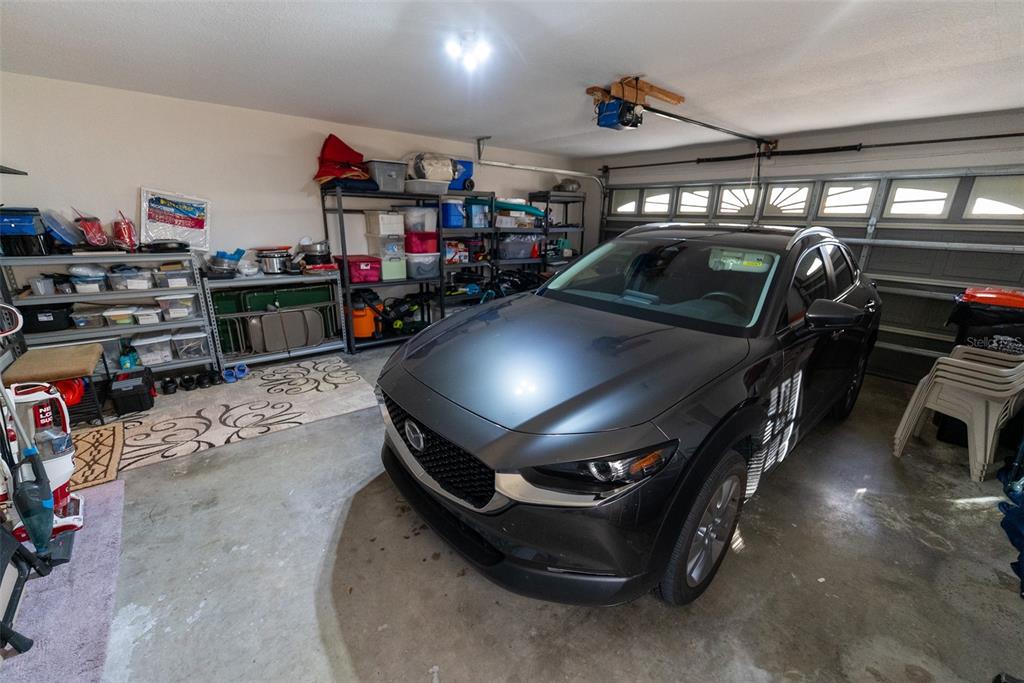 10470 Southwest 61st Terrace Road Ocala, FL 34476 - Photo 62 of 63 a view of parking garage with cars