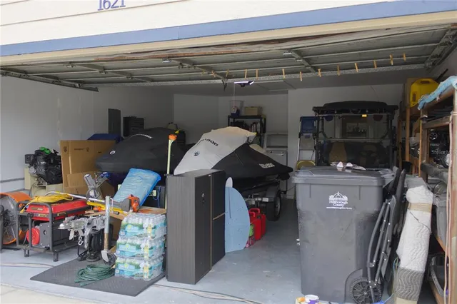 a view of a room with wooden floor and a bathroom