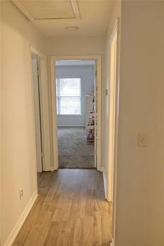 a living room with lots of furniture and clutter