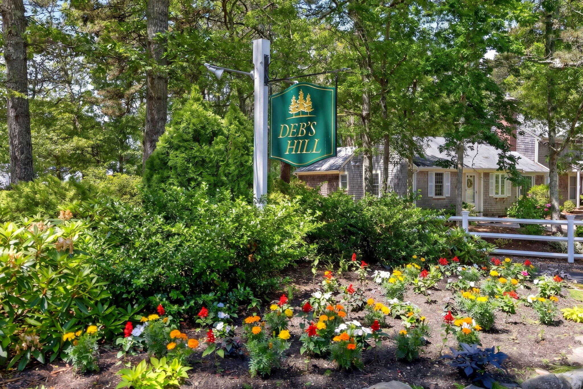 35 Debs Hill Road, Unit 35 Yarmouth Port, MA 02675 - Photo 31 of 36 a view of a garden with flowers and flowers