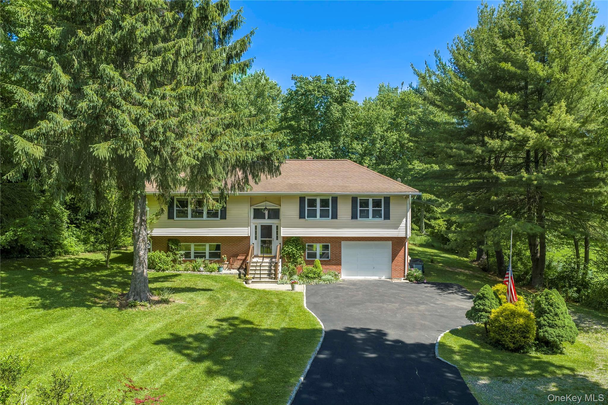 32 Cobb Road Brewster, NY 10509 - Photo 2 of 49 a front view of a house with a garden