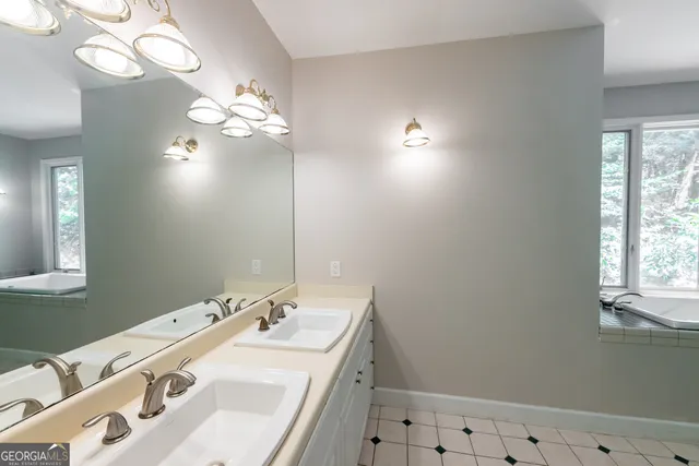 a bedroom with a large bed and a tv