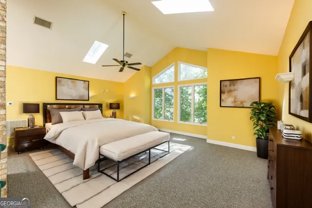 a front view of a house with a yard covered with snow