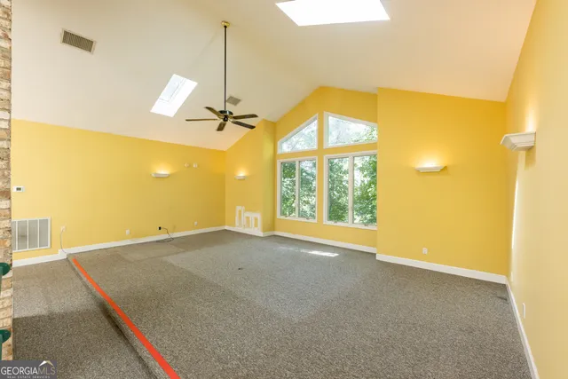 a view of a house with backyard and porch