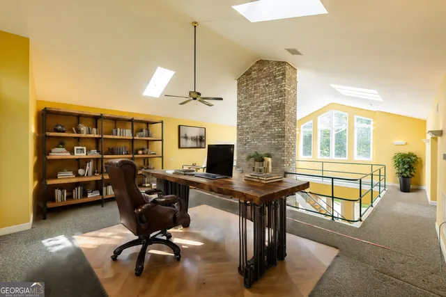 a view of balcony with wooden floor and fence and a window