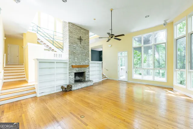 a living room with fireplace furniture and a chandelier
