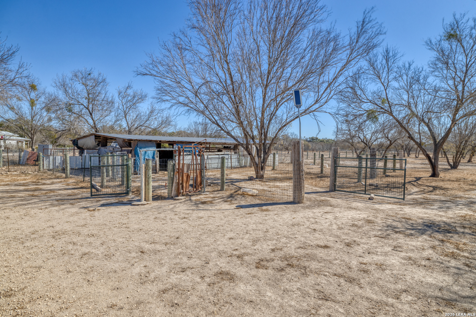 1140 Curtis Bourne Road Crystal City, TX 78839 - Photo 12 of 54 a view of a house with a yard covered with snow in the background