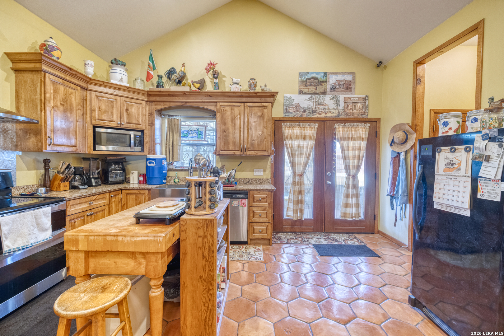 1140 Curtis Bourne Road Crystal City, TX 78839 - Photo 21 of 54 a living room with fireplace furniture and a floor to ceiling window