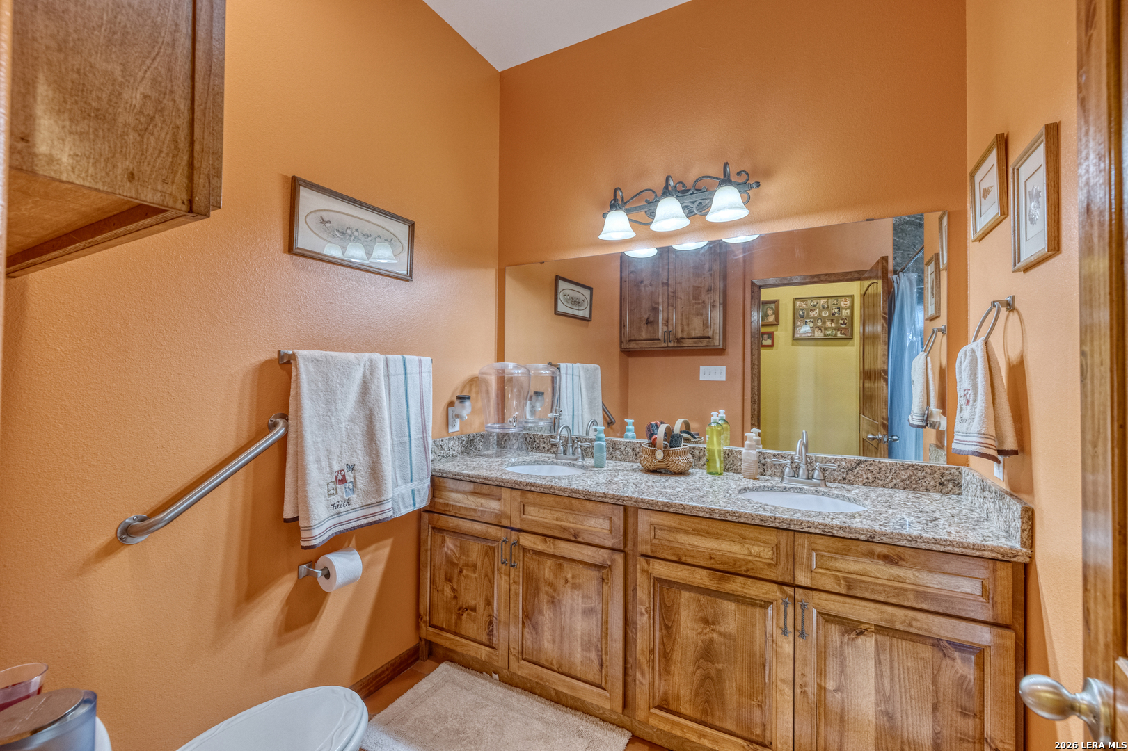 1140 Curtis Bourne Road Crystal City, TX 78839 - Photo 27 of 54 a bathroom with a sink a mirror and a toilet