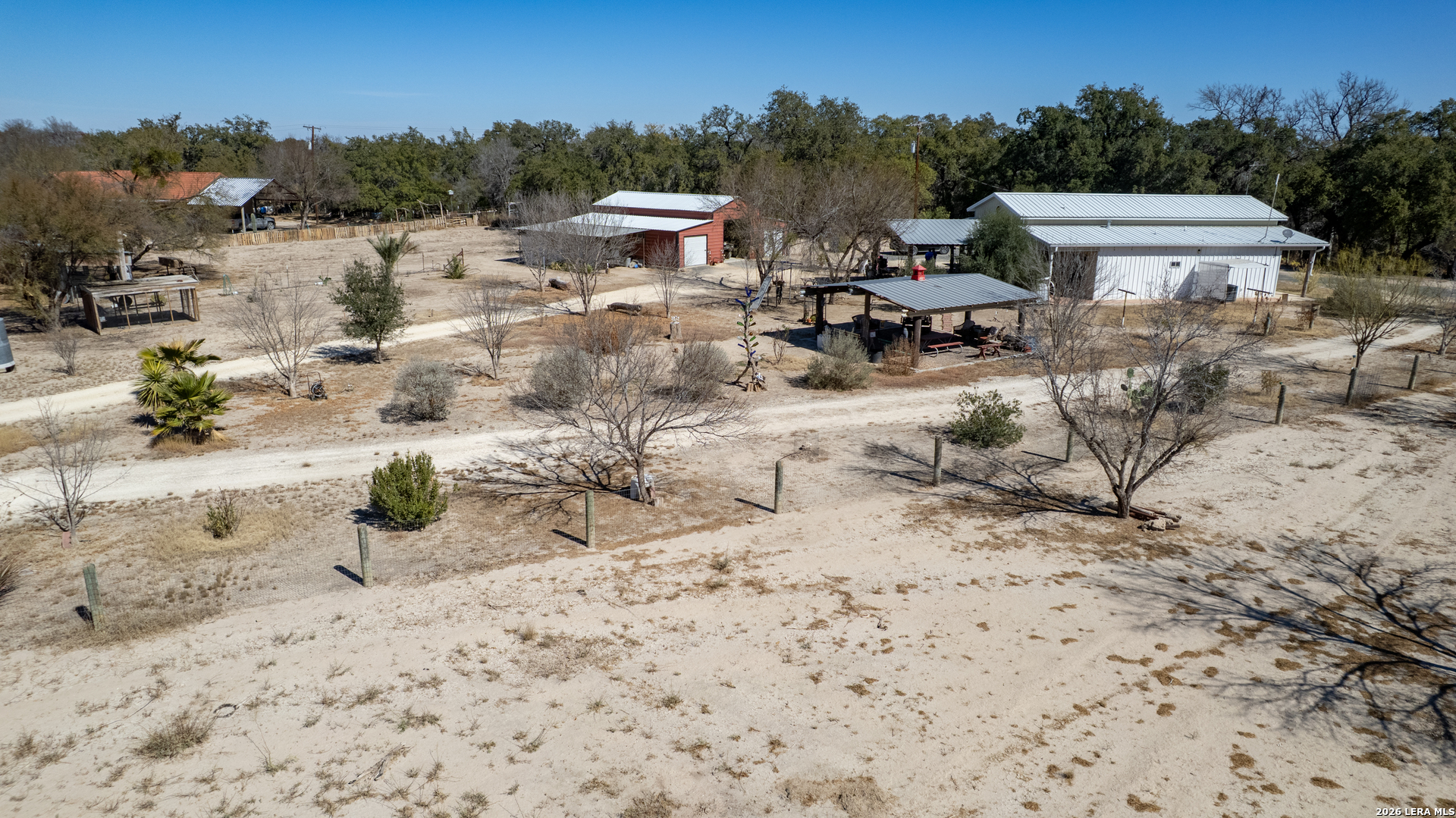 1140 Curtis Bourne Road Crystal City, TX 78839 - Photo 46 of 54 a view of a terrace with chairs and wooden fence