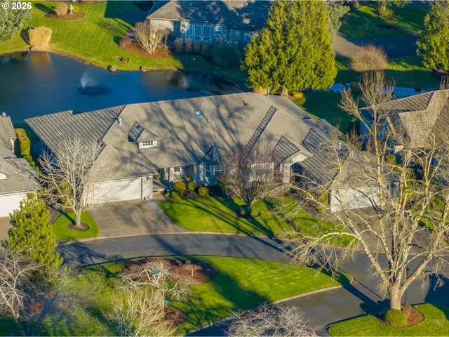 a view of a swimming pool with a yard