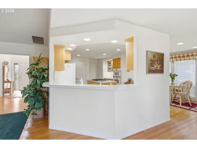 a kitchen with a table and chairs