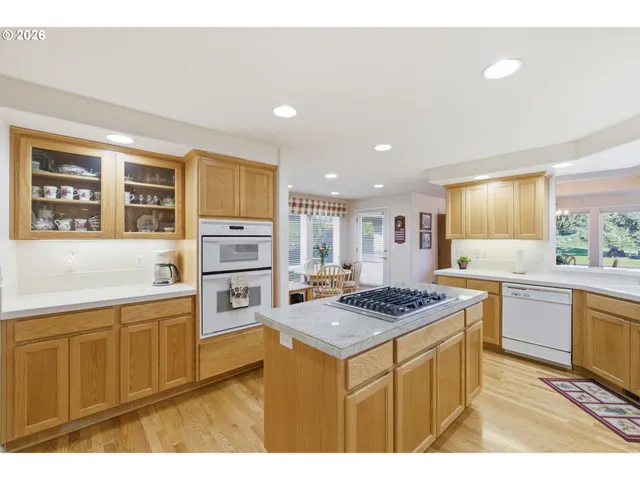 a kitchen with kitchen island a counter top space and a sink
