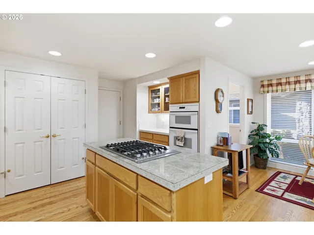 a view of kitchen with furniture and wooden floor