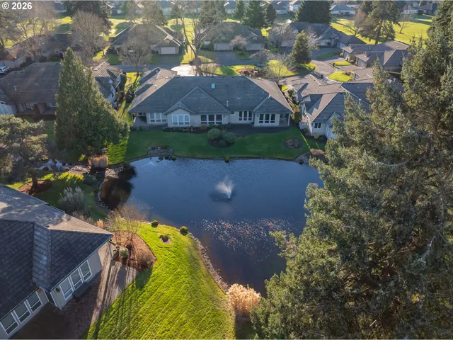 an aerial view of house with yard swimming pool and outdoor seating