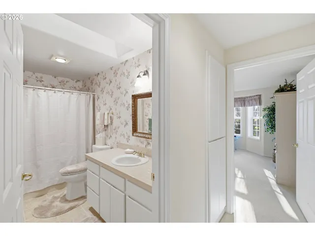 a living room with furniture and large windows