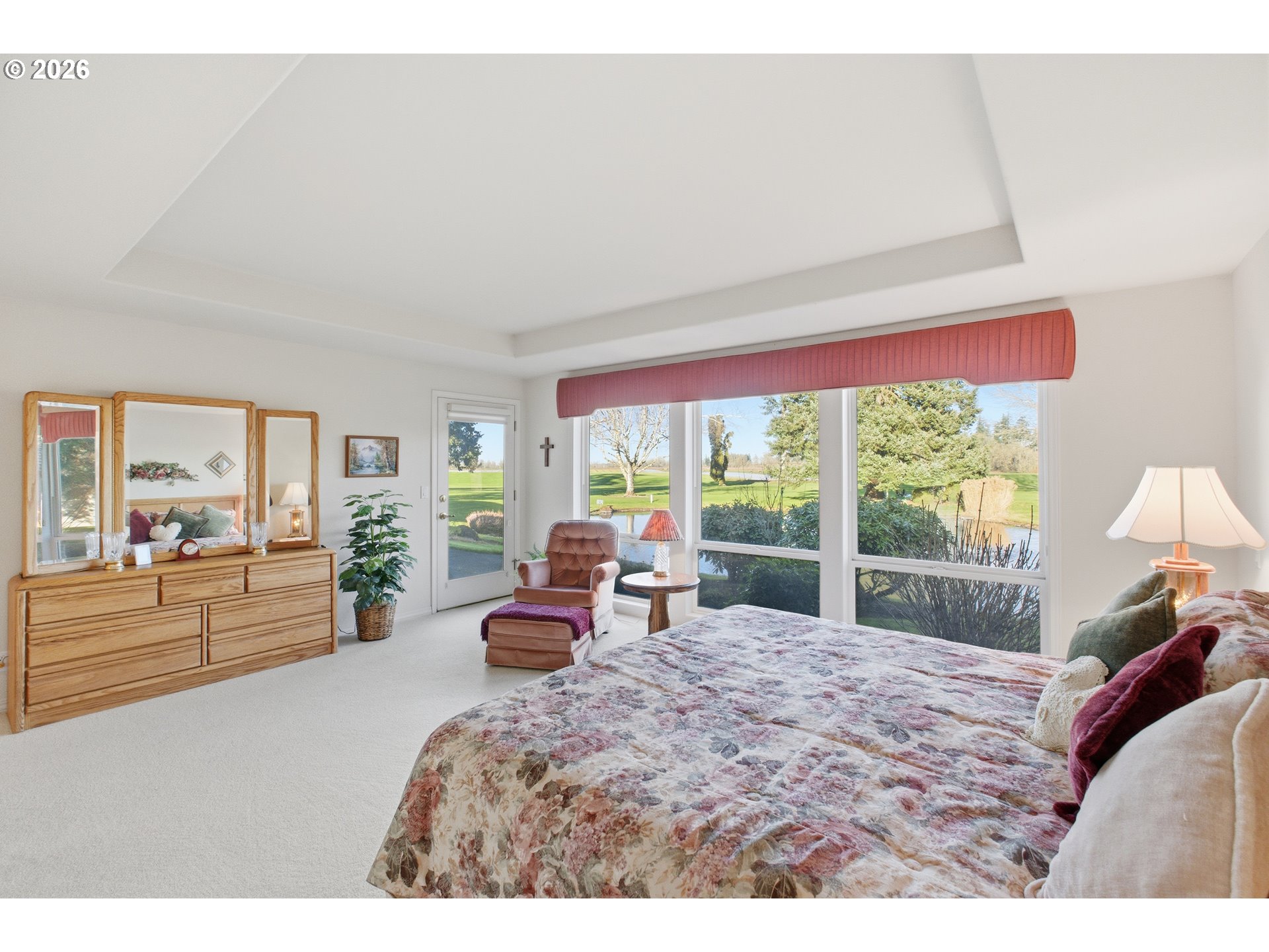 6428 Castle Lakes Court Keizer, OR 97303 - Photo 31 of 48 a large bedroom with a large bed and a large window