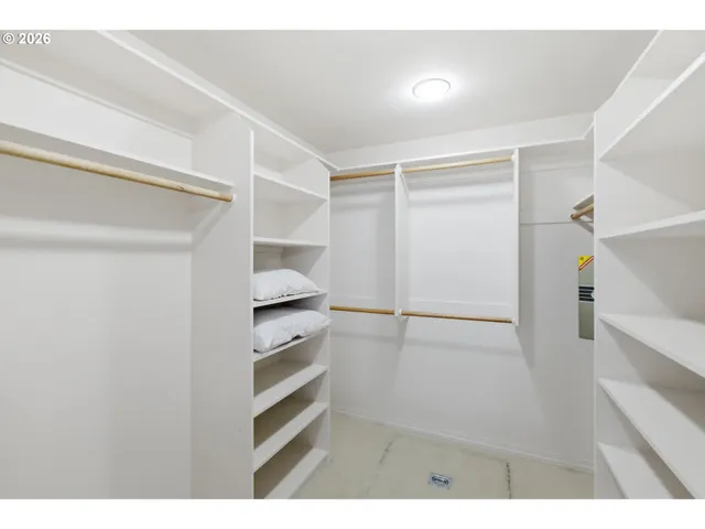 a living room with furniture and a book shelf