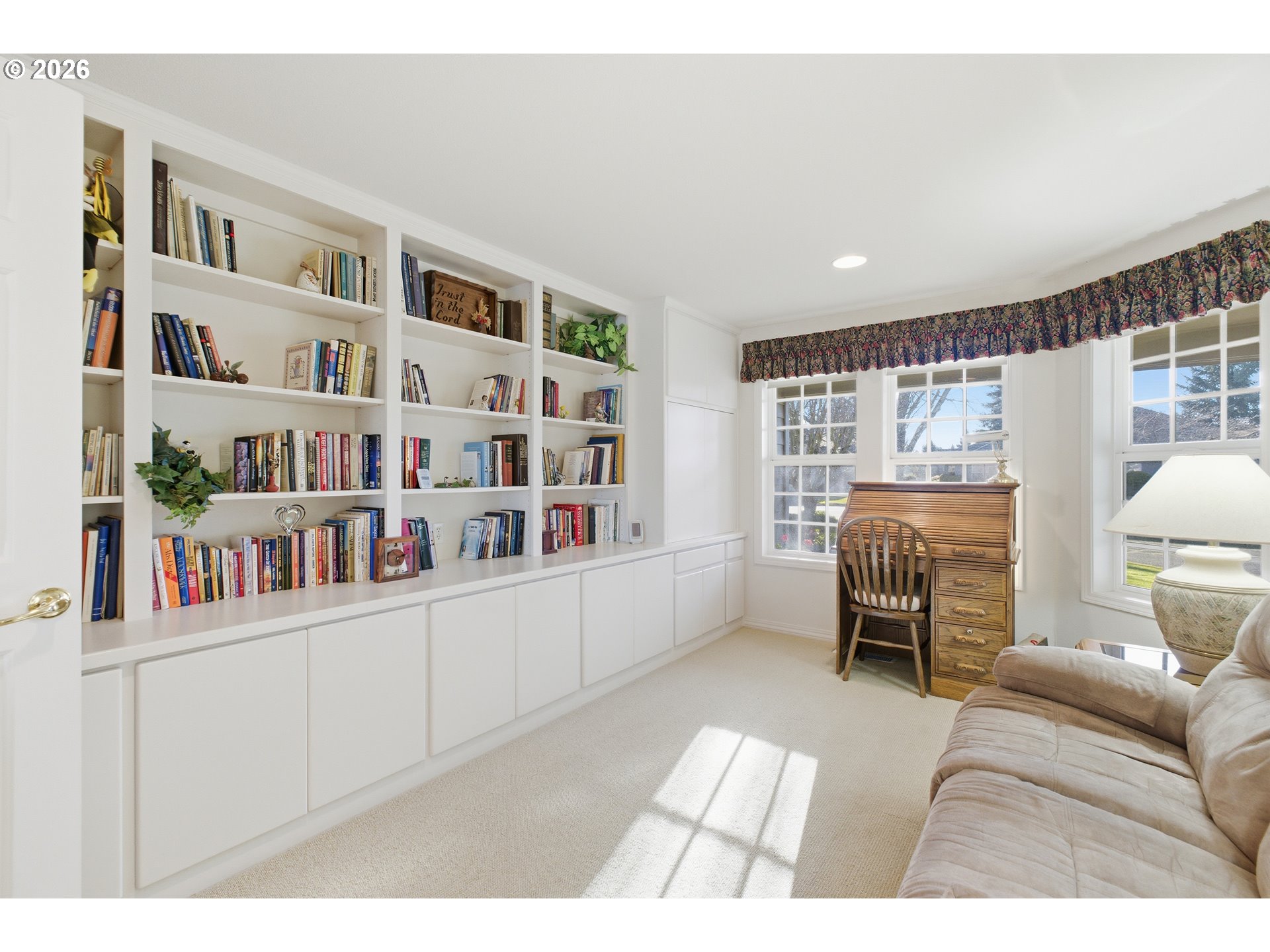 6428 Castle Lakes Court Keizer, OR 97303 - Photo 36 of 48 a living room with furniture and a book shelf