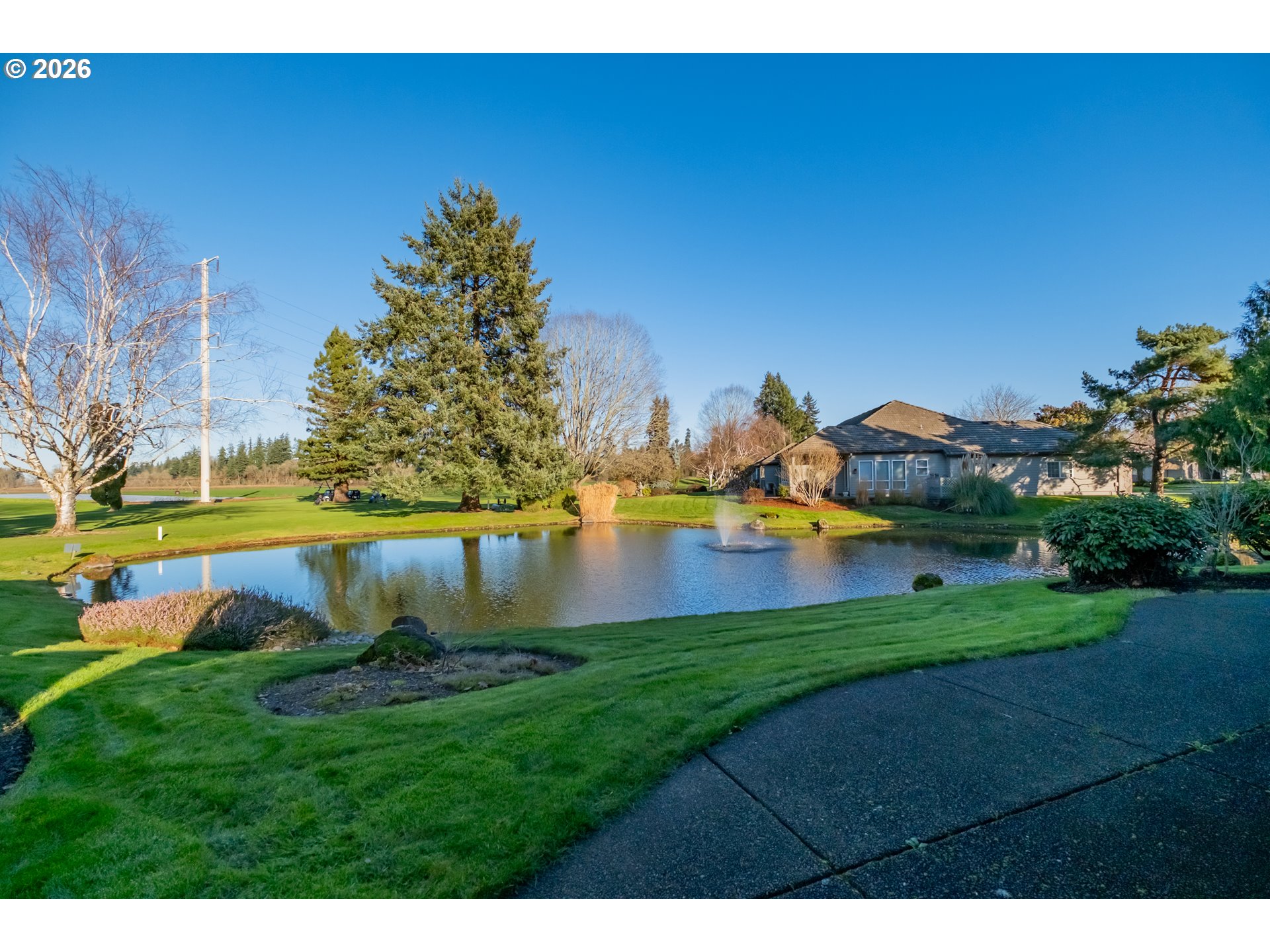 6428 Castle Lakes Court Keizer, OR 97303 - Photo 42 of 48 a view of a lake with houses in the background
