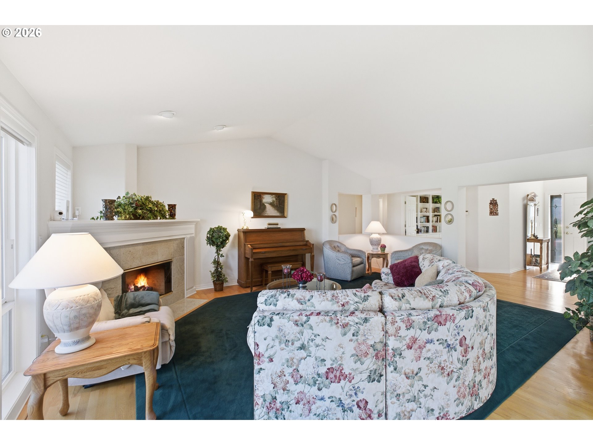 6428 Castle Lakes Court Keizer, OR 97303 - Photo 10 of 48 a living room with fireplace furniture and a wooden floor
