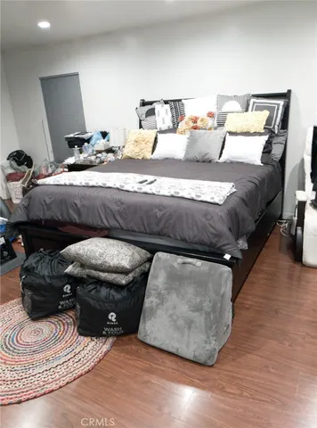 a bedroom with a bed and a mirror