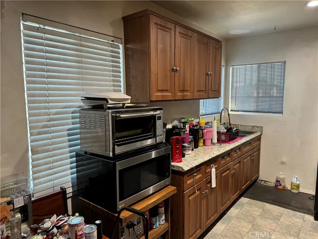 a kitchen with a stove and a sink