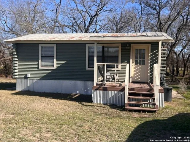 a front view of a house with stairs