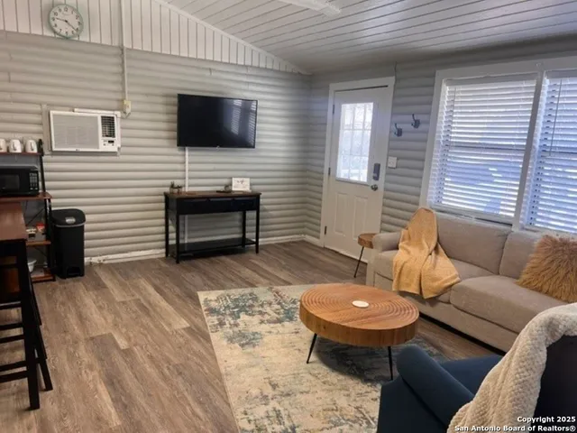 a balcony with furniture and a fireplace