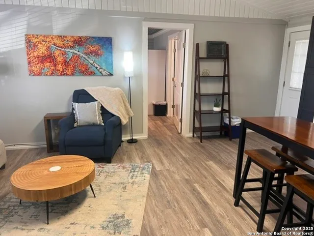 a view of a livingroom with furniture and wooden floor