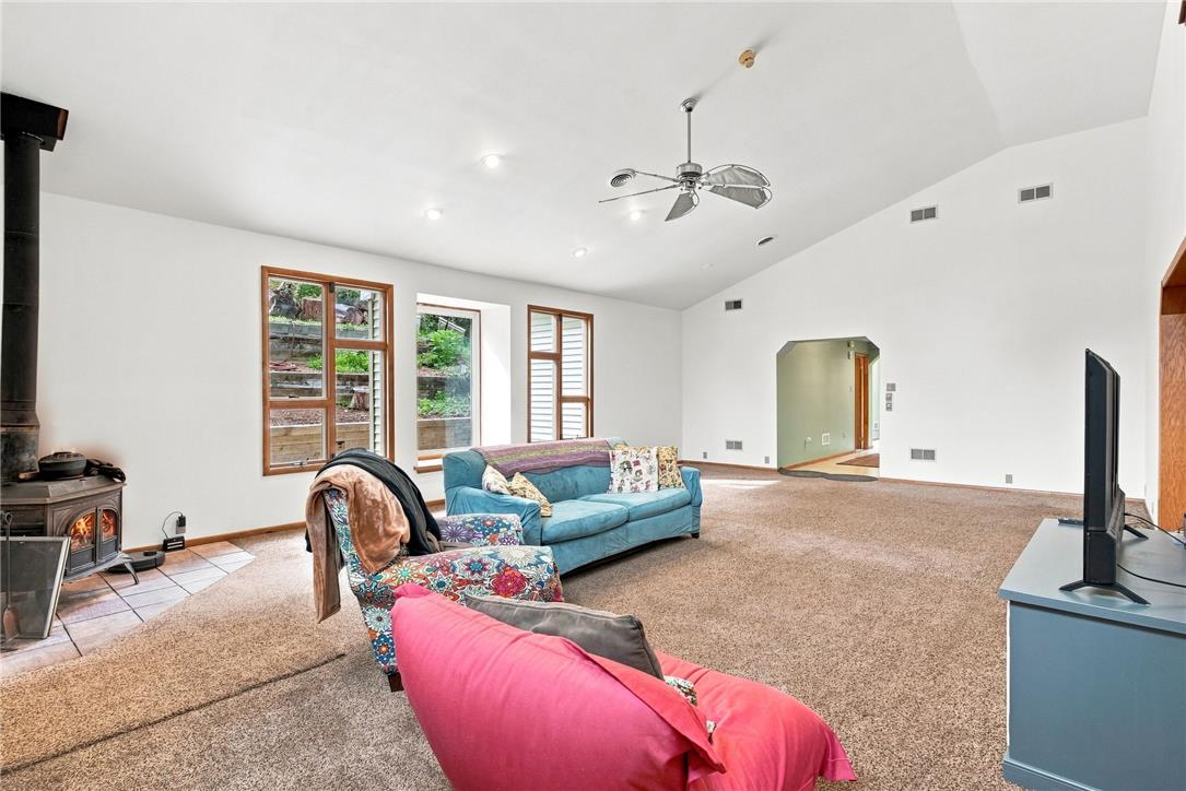 3408 Oak Hill Road Emmaus, PA 18049 - Photo 15 of 93 Vaulted ceilings and a classic wood stove anchor this comfortable living area.